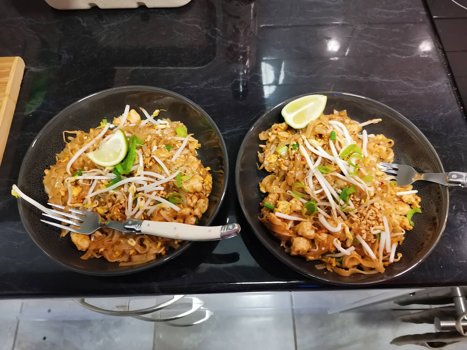 Delicious Pad Thai Noodles In Black Bowls Wallpaper