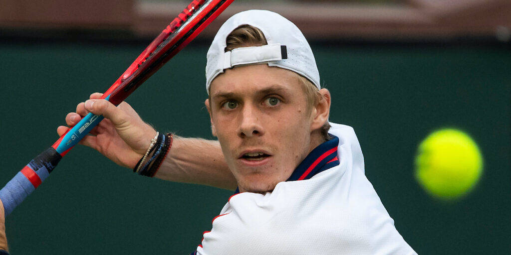 Denis Shapovalov In Focus During A Tennis Match Wallpaper