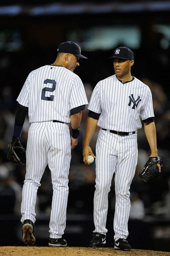 Derek Jeter Interacting With Teammate Wallpaper