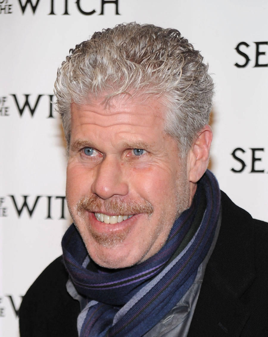 Distinguished Actor Ron Perlman Donning A Stylish Scarf. Wallpaper