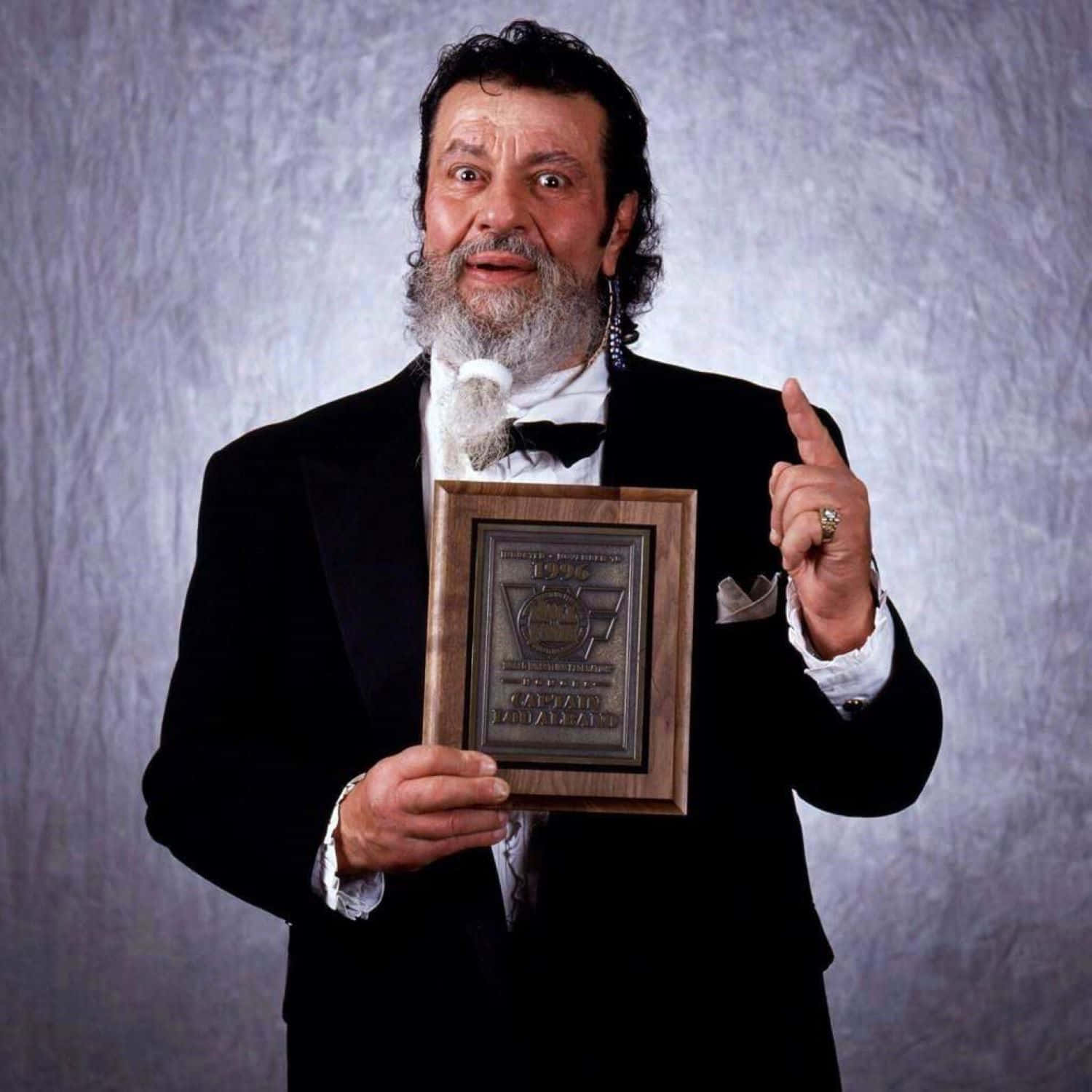 Distinguished Gentleman Holding Award Wallpaper