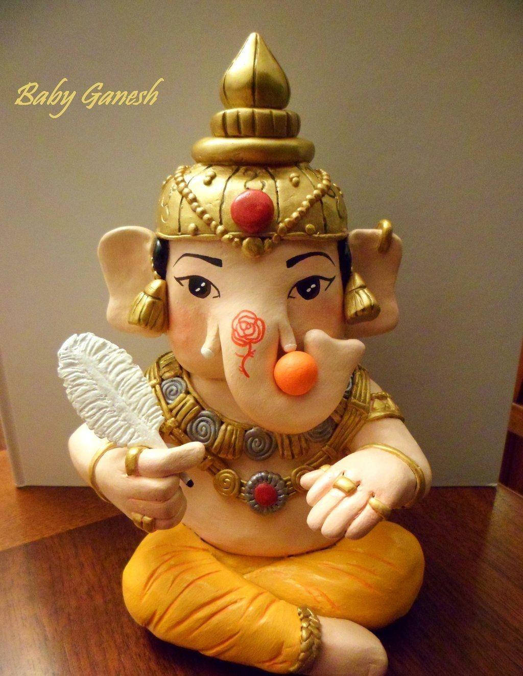 Divine Bal Ganesh Sculpture Wallpaper