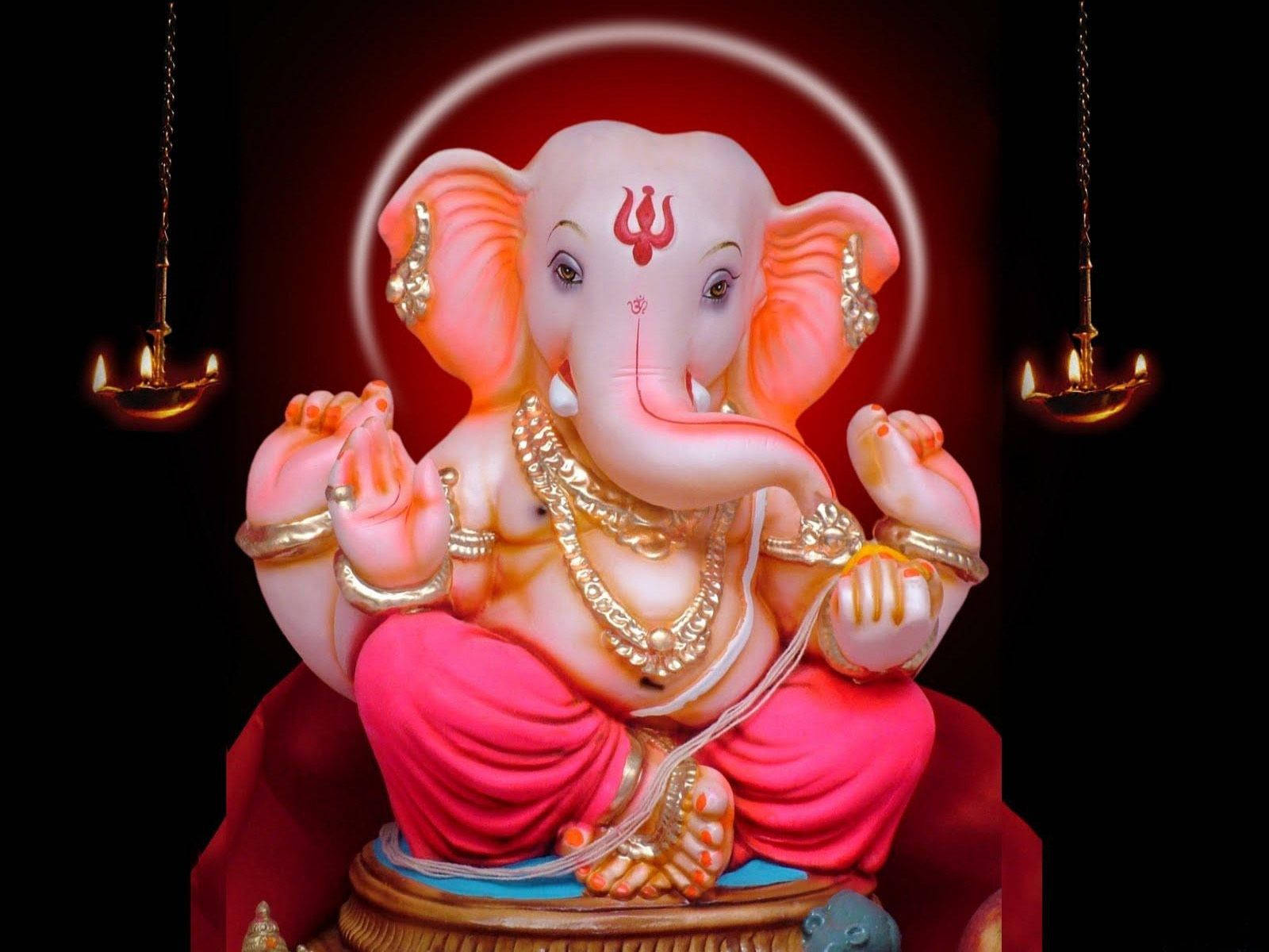 Divine Marble Statue Of Lord Ganesh Wallpaper