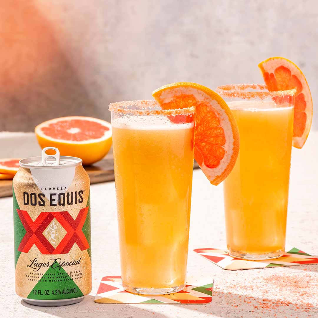 Dos Equis Beerwith Grapefruit Garnish Wallpaper