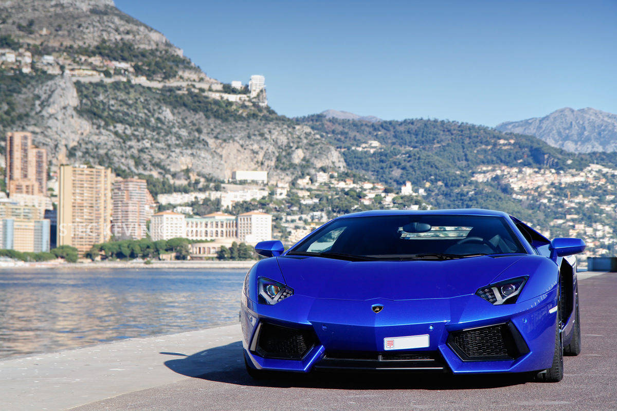 Driving A Lamborghini On The Waterfront Wallpaper