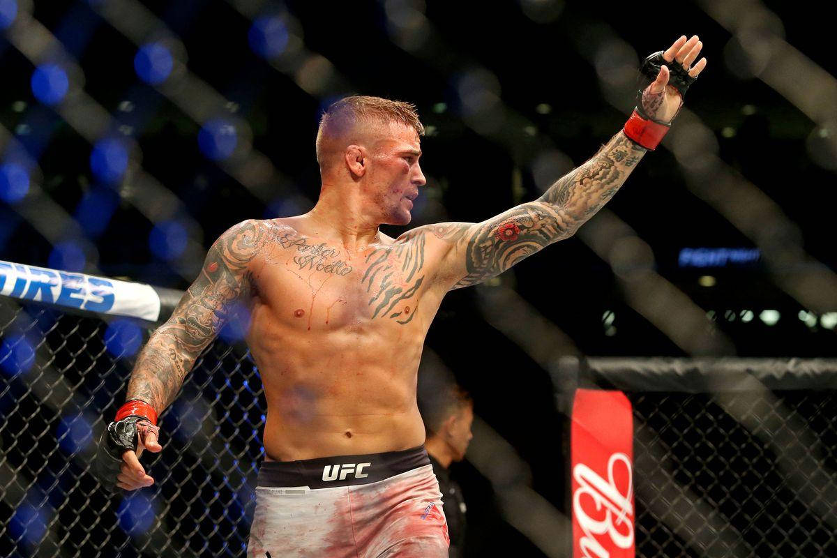 Dustin Poirier Bloody Face Raised Hand Wallpaper