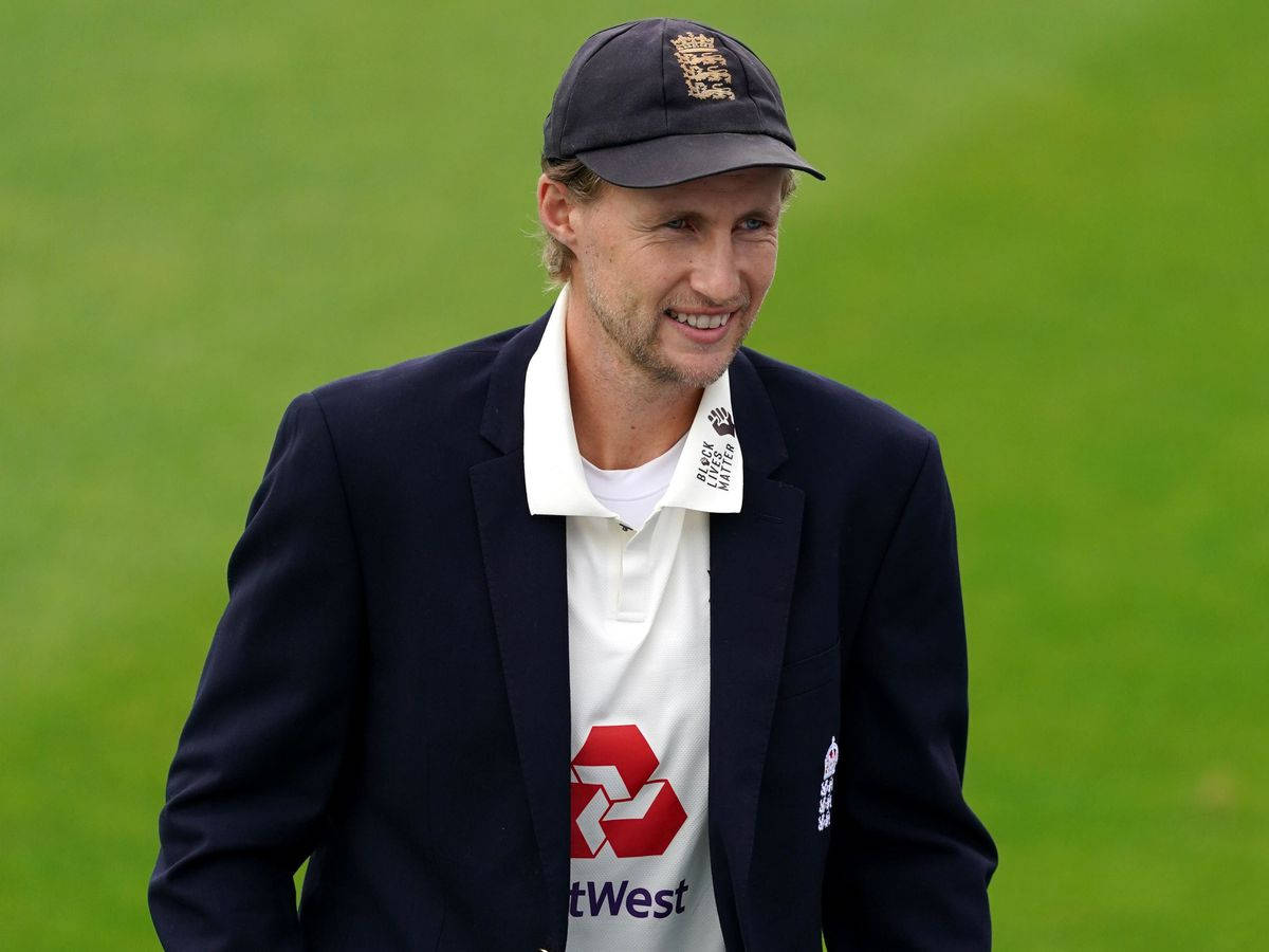 Elegant Joe Root In Black Coat Wallpaper