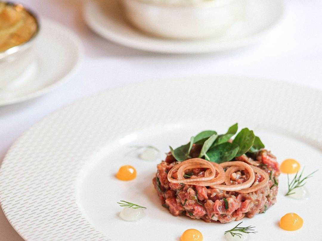 Elegant Steak Tartare With Confit Egg Wallpaper