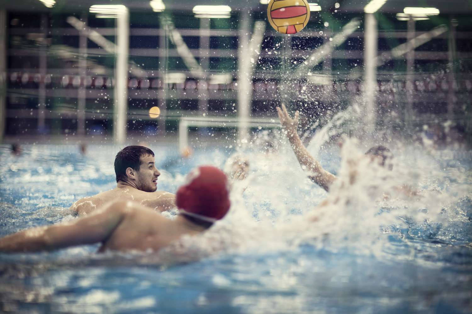 Energetic Water Polo Players Celebrating Victory Wallpaper