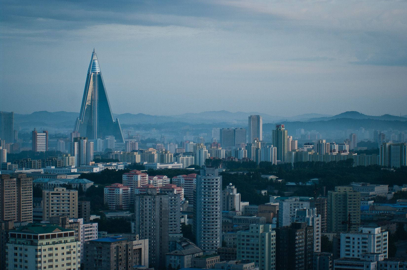 Enigmatic View Of Pyongyang And Ryugyong Hotel Wallpaper