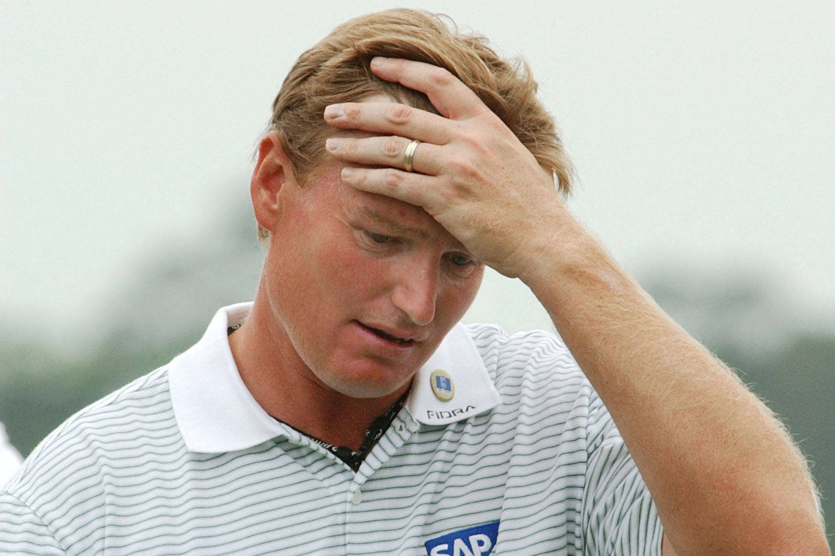 Ernie Els Hand On Forehead Wallpaper