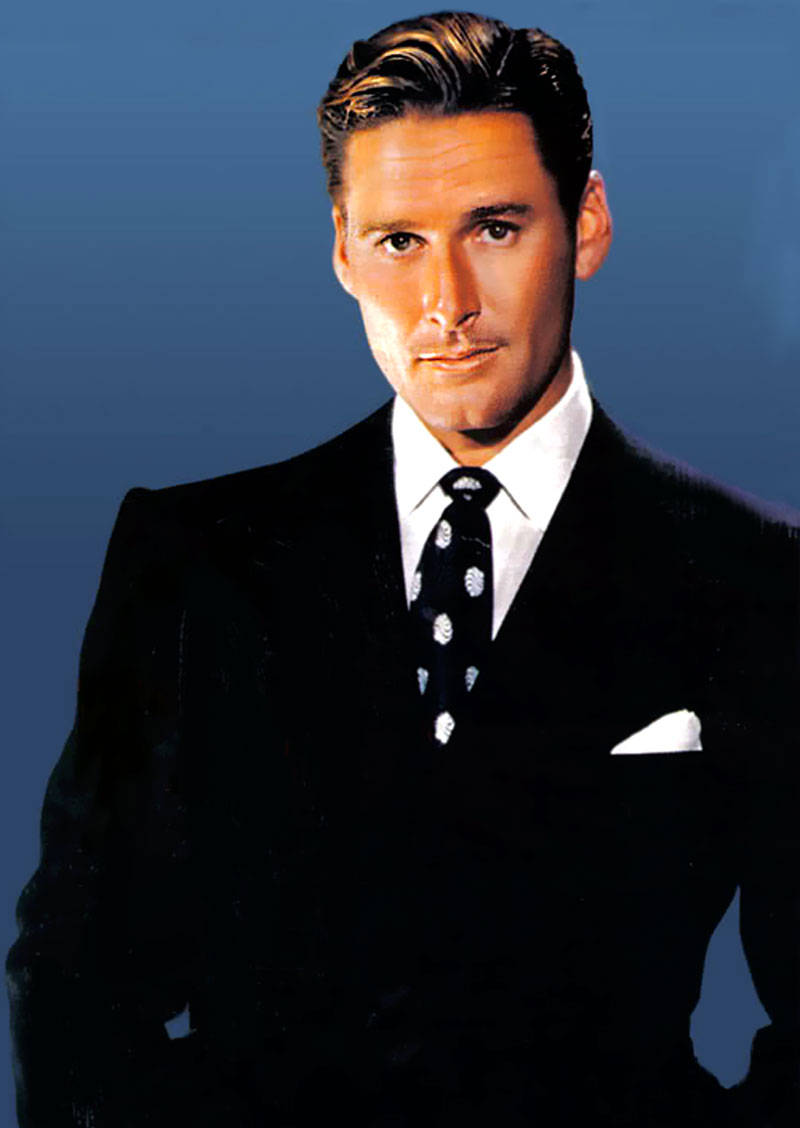 Errol Flynn In Black Suit With Blue Background Wallpaper