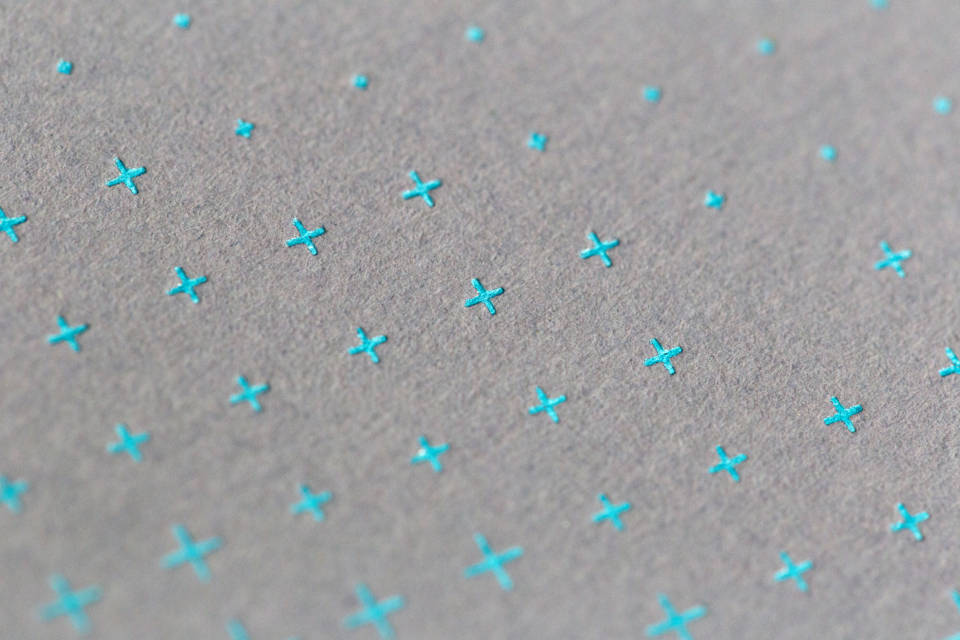Exquisite Blue Crosses On Gray Paper Texture Wallpaper