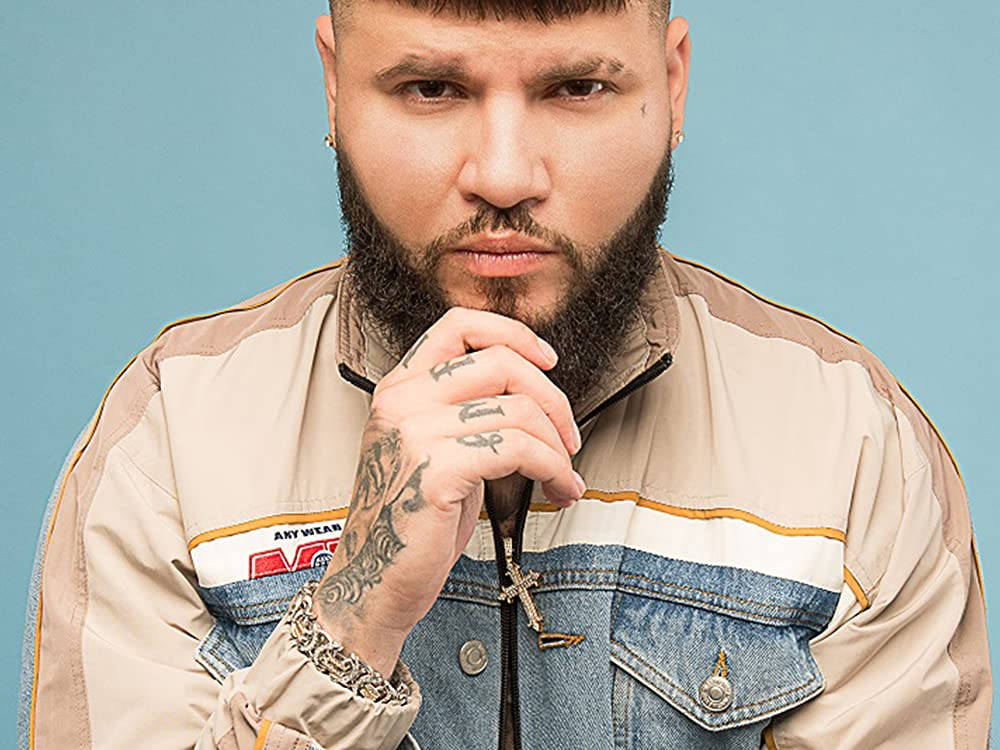 Farruko Holding His Chin Wallpaper