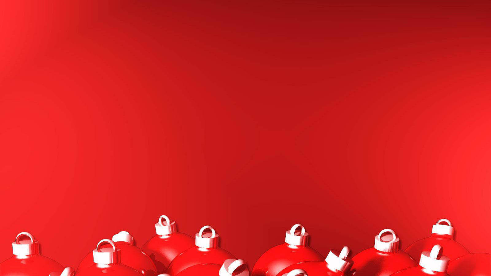 Festive Glistening Christmas Ornaments On A Regal Red Background Wallpaper