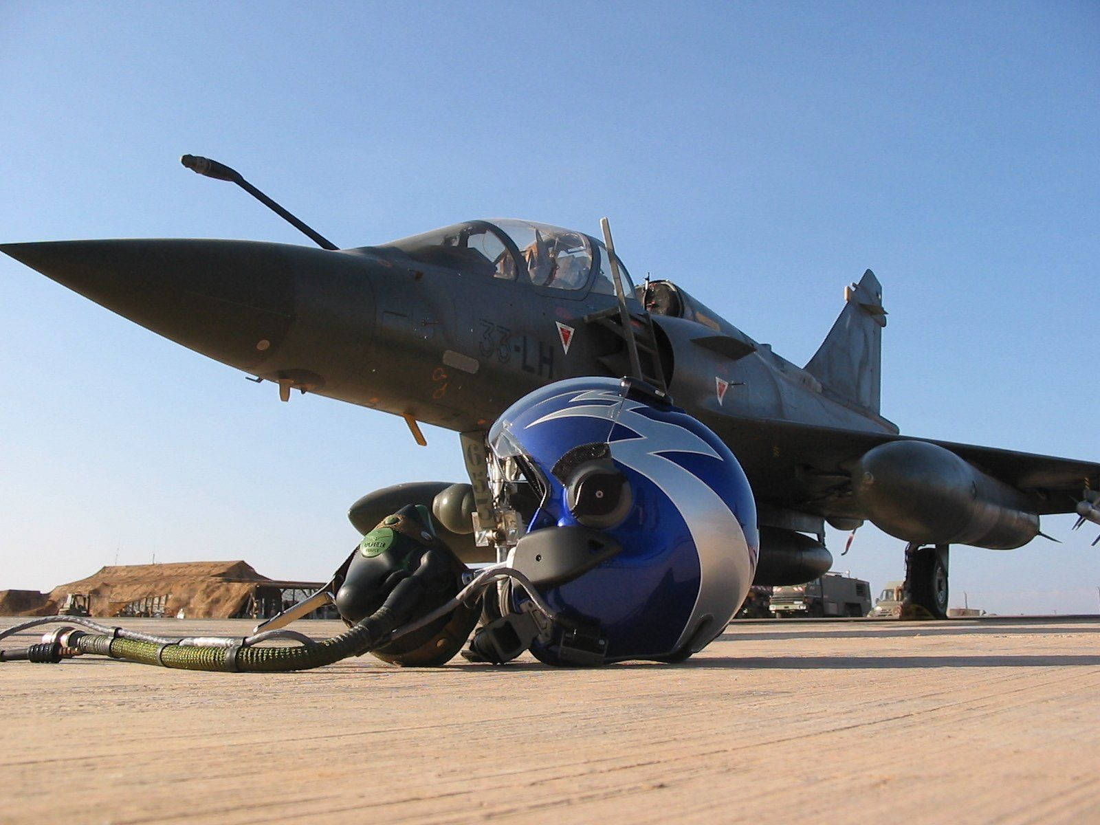 Fighter Jet With A Pilot Helmet Wallpaper