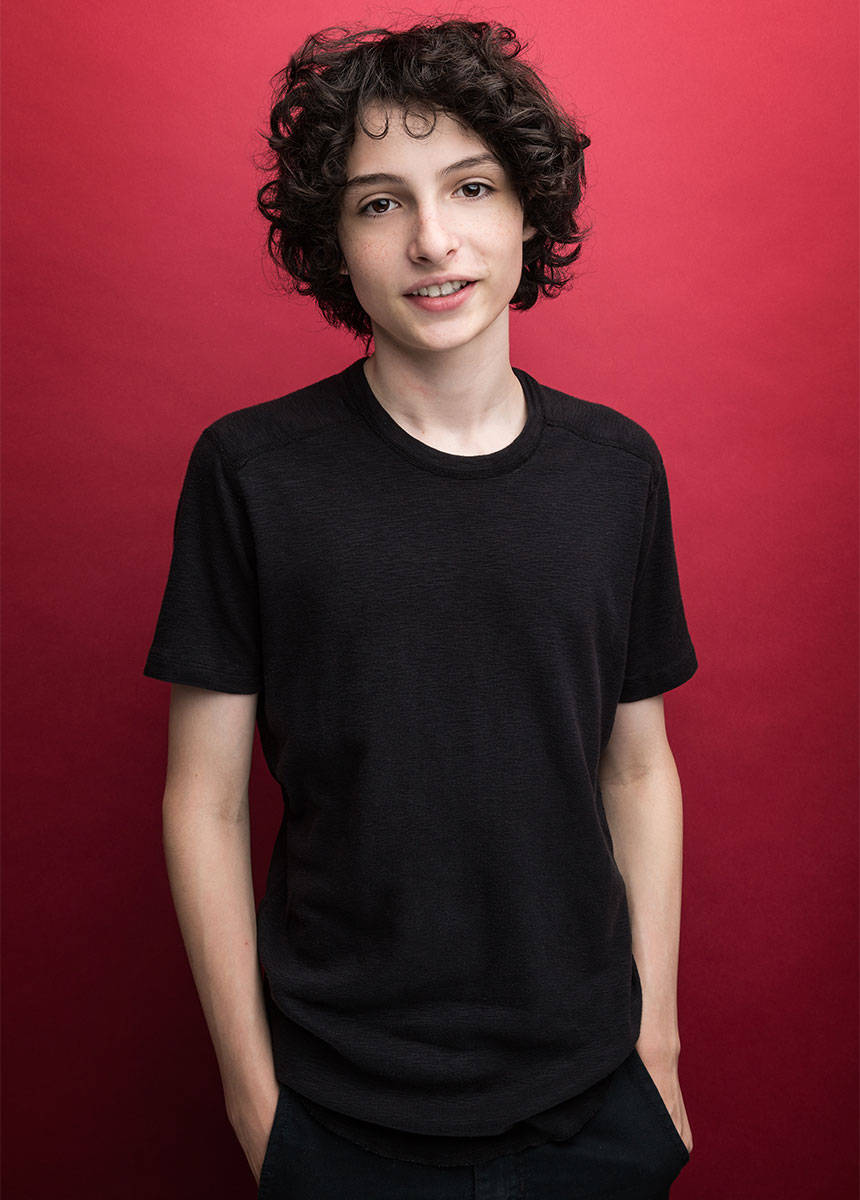 Finn Wolfhard Hands In Pockets Wallpaper