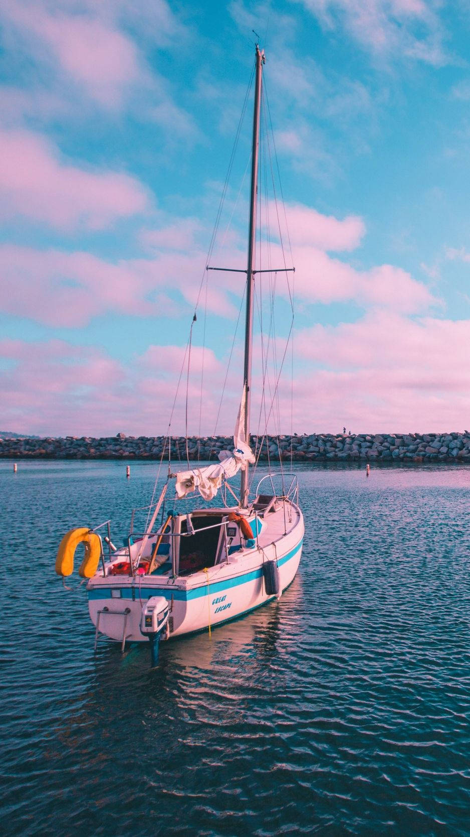 Floating Pink Boat With Pink Clouds Above Wallpaper