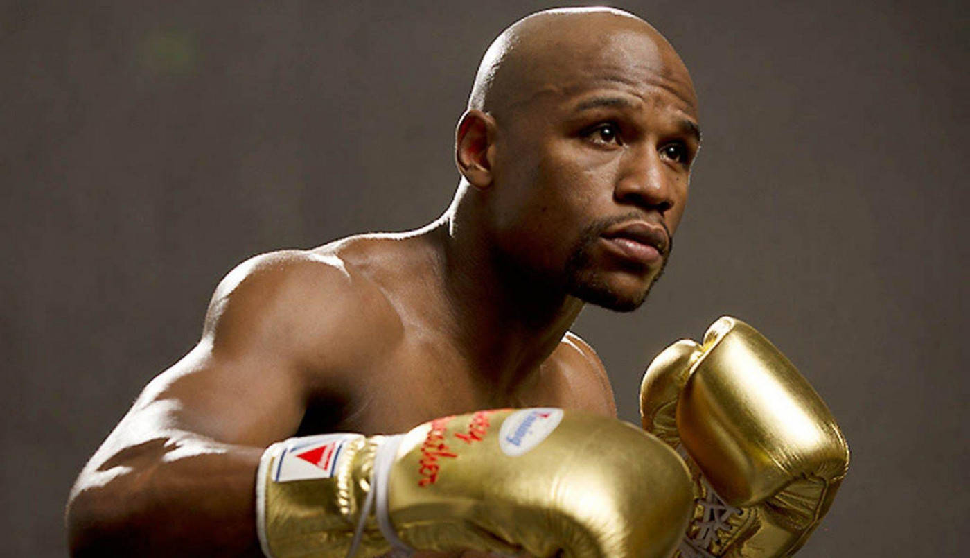 Floyd Mayweather Wearing Golden Boxing Gloves Wallpaper