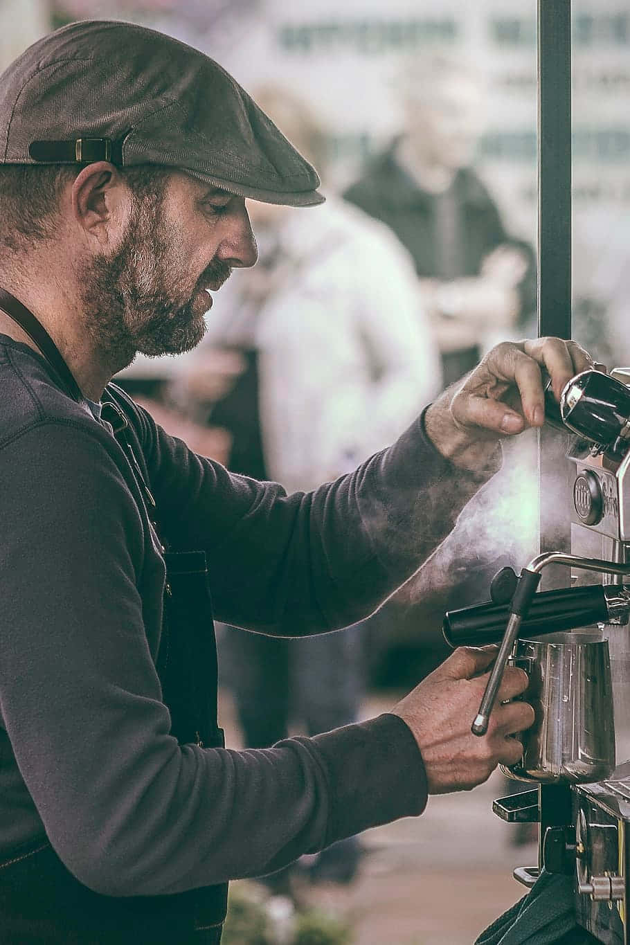 Focused Barista Preparing Coffee Wallpaper