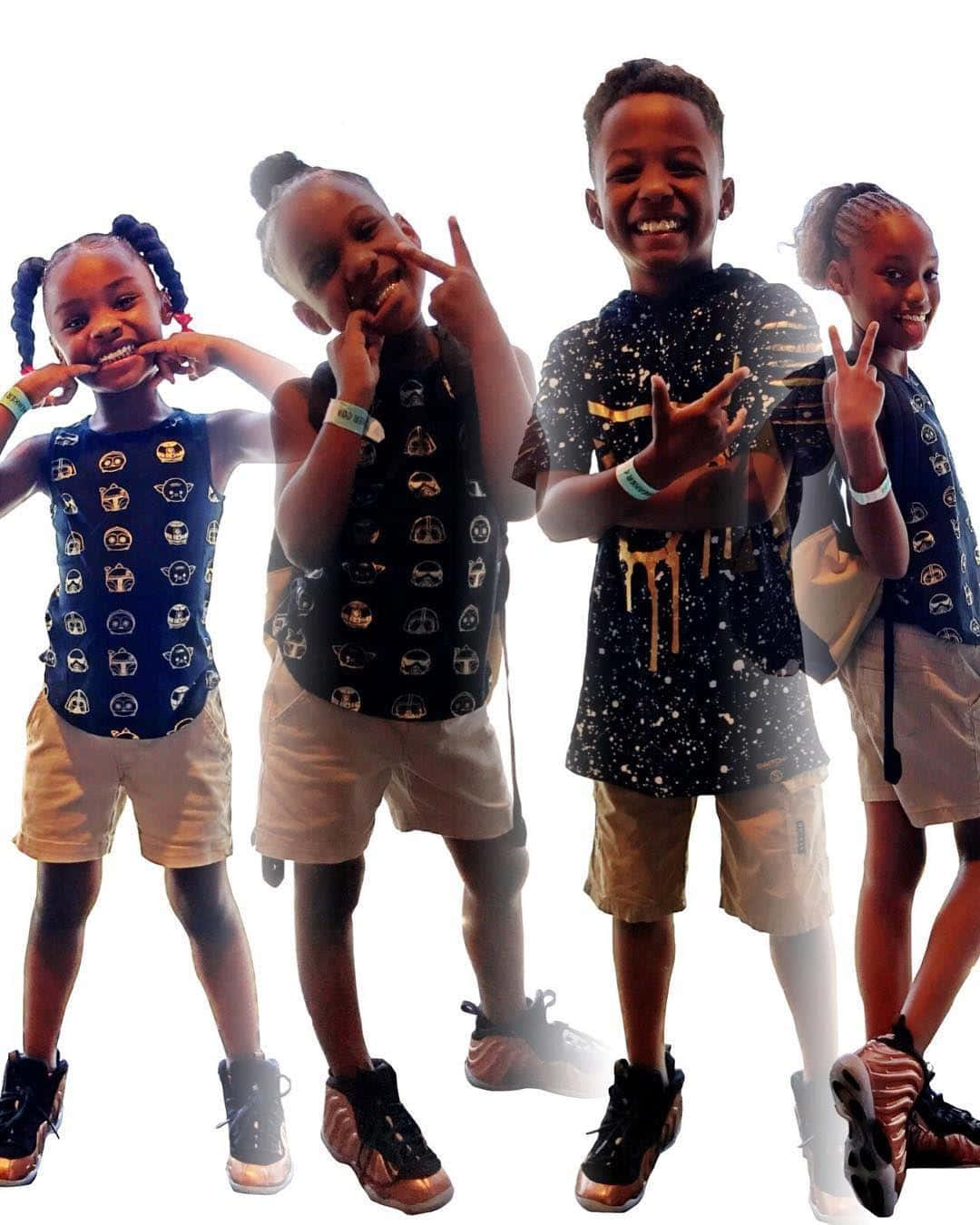 Four Children In Black And White Pose For A Photo Wallpaper