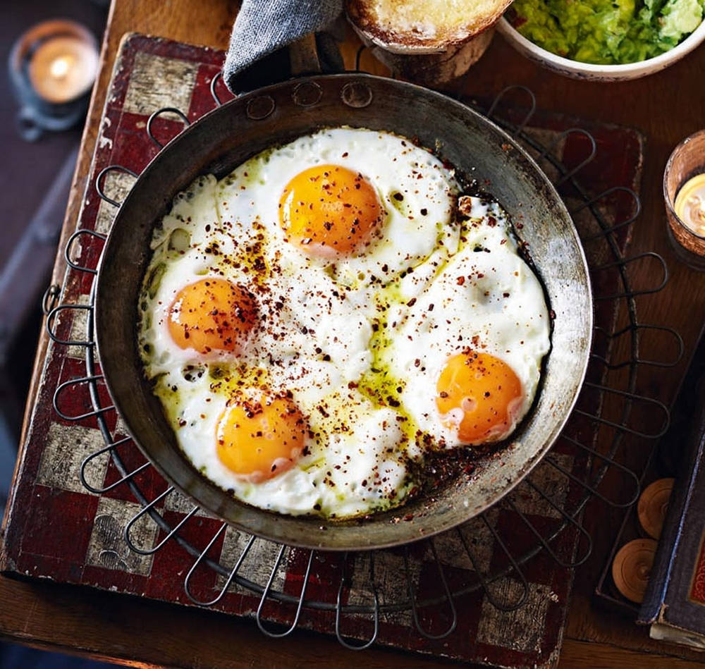 Four Fried Eggs In A Skillet Wallpaper