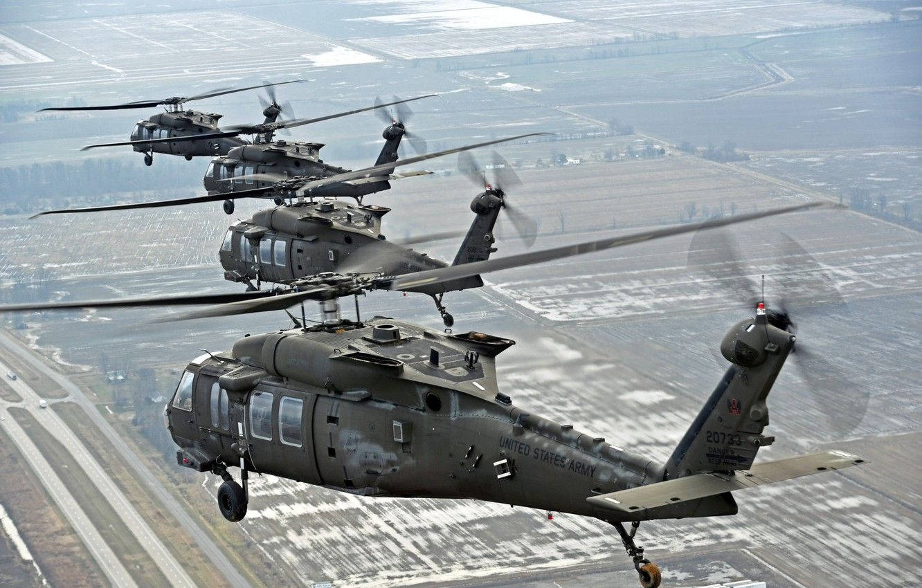 Four Uh-60m Black Hawk Helicopters Wallpaper