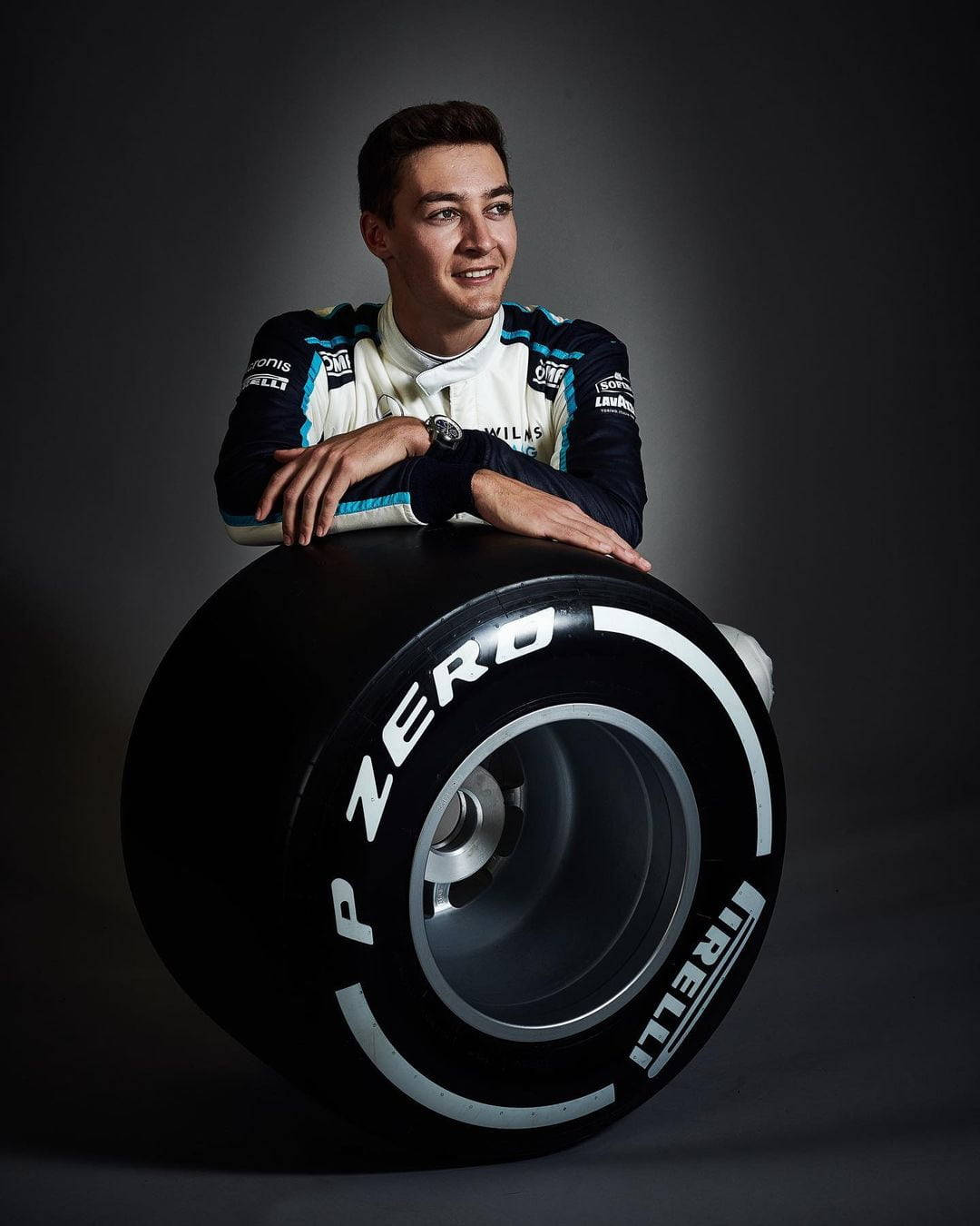 George Russel Leaning On Wheel Wallpaper