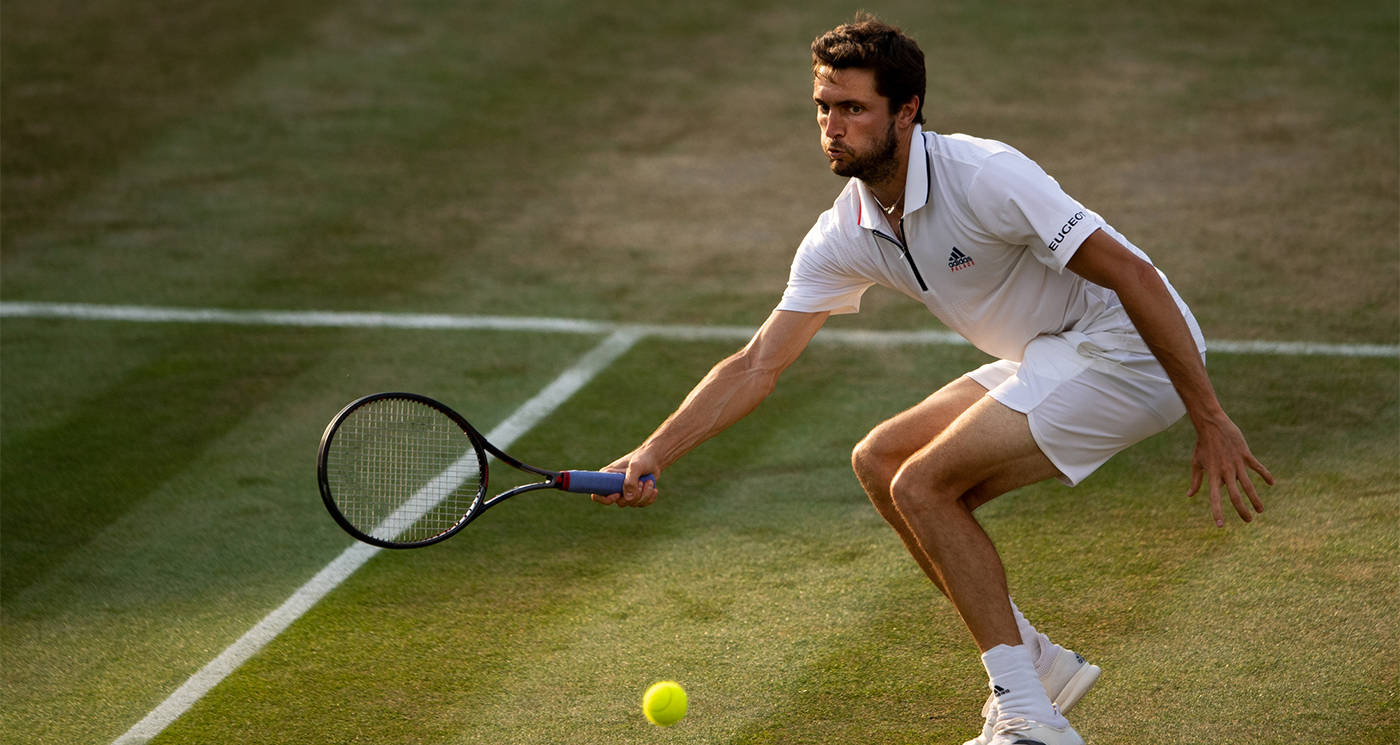 Gilles Simon Missing The Ball At Wimbledon Wallpaper