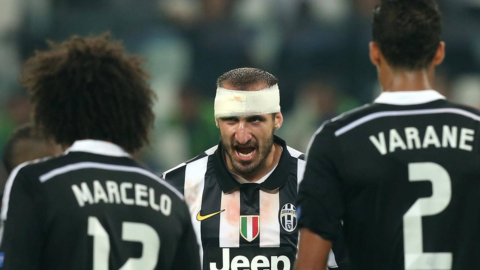 Giorgio Chiellini In Action Against Marcelo Vieira And Raphael Varane Wallpaper