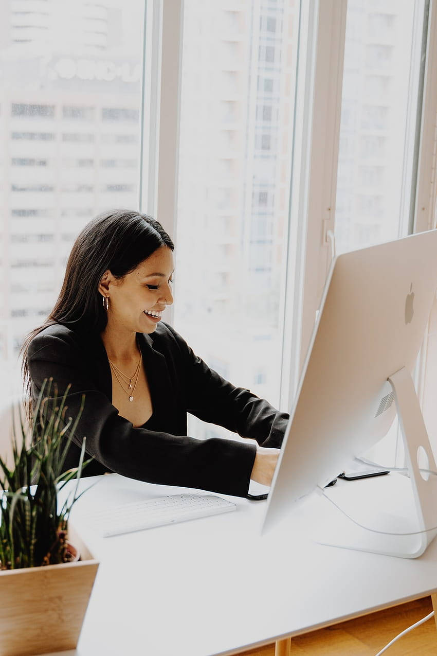 Girl At Work Smiling Wallpaper