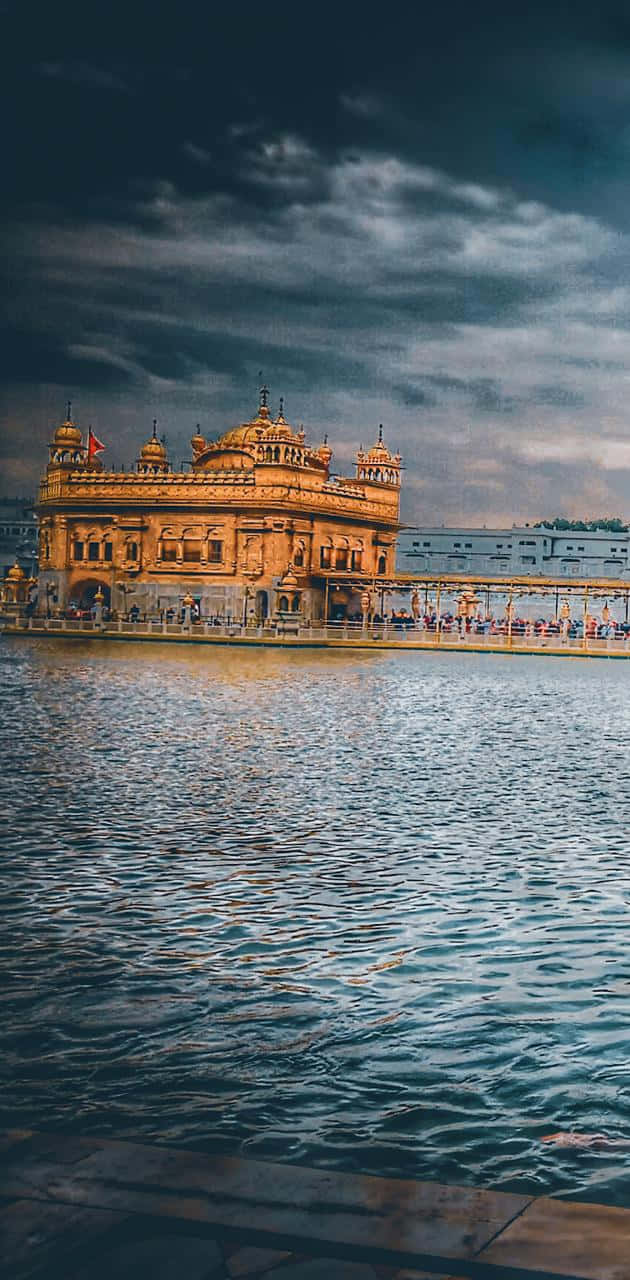 Golden Temple On A Stormy Day Wallpaper