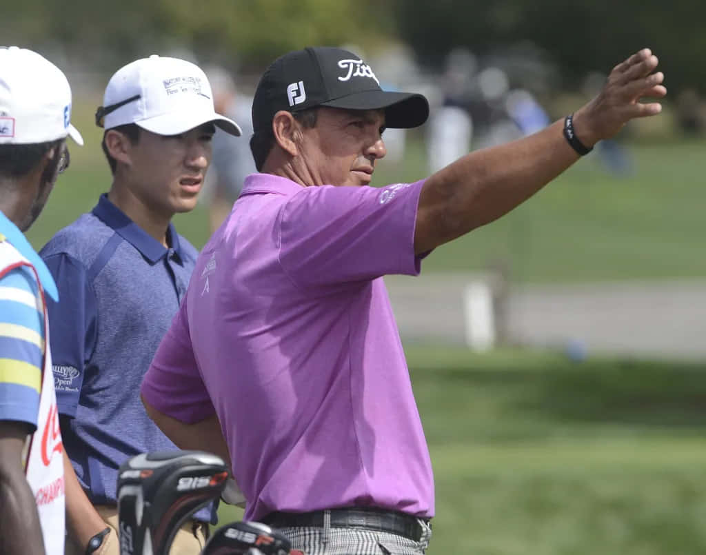 Golfer Tom Pernice Jr Gesturing During Event Wallpaper