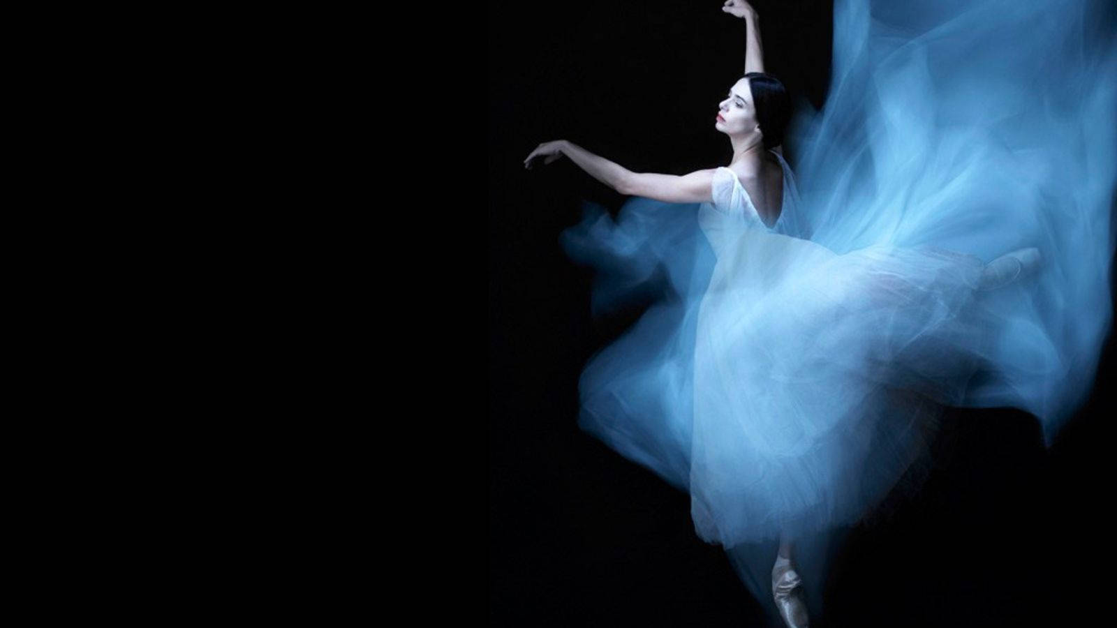 Grace In Motion - Prima Ballerina Alessandra Ferri In The Midst Of A Captivating Dance Pose Wallpaper