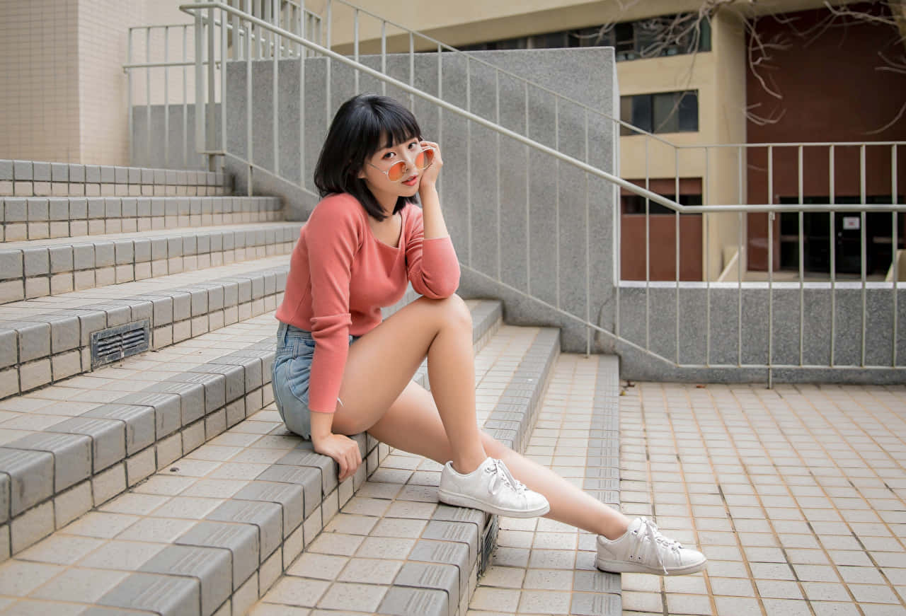 Graceful Female Thighs In White Sneakers Wallpaper