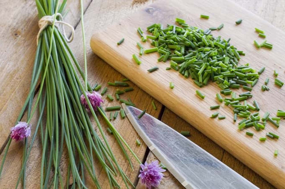 Green Chives Vegetable With Purple Blossoms Wallpaper