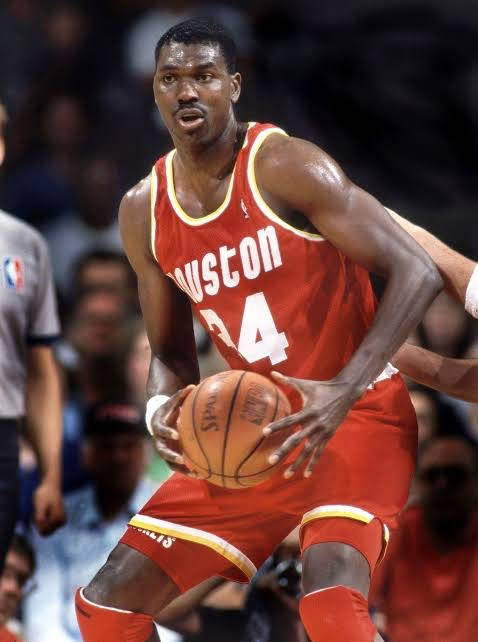 Hakeem Olajuwon Holding A Ball Wallpaper