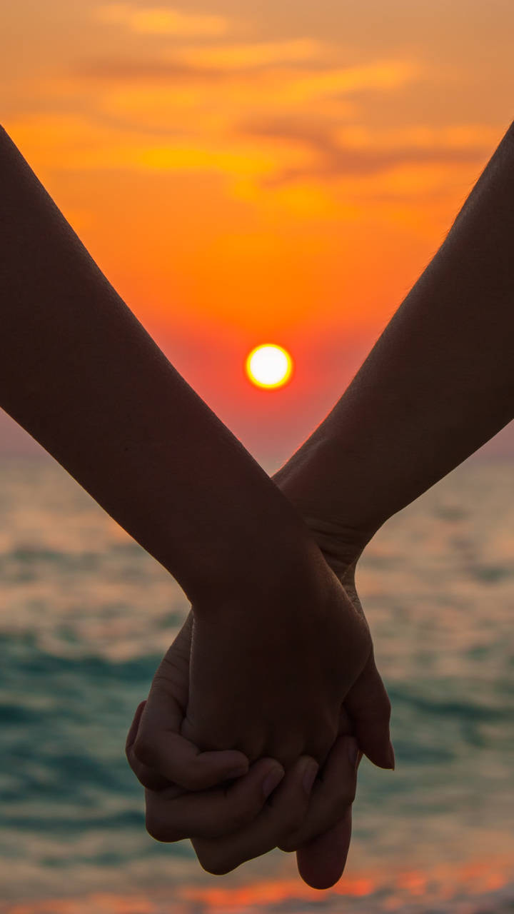 Hand In Hand Sunset Wallpaper