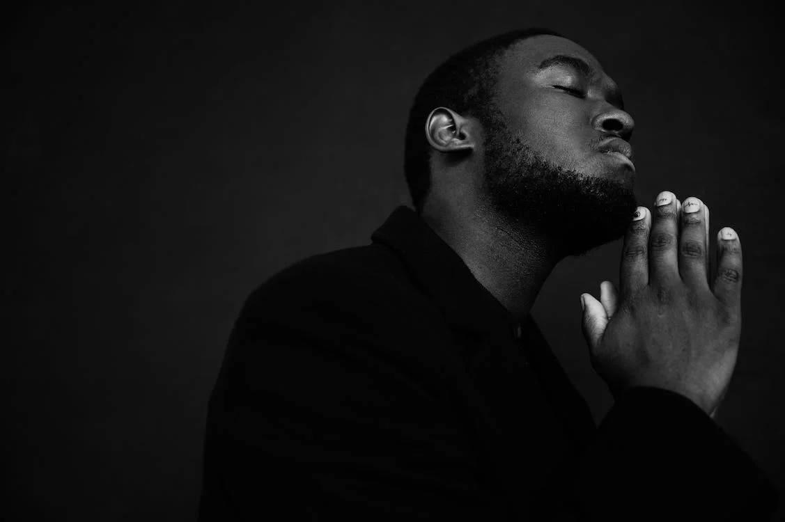 Handsome Black Man Prayer Gesture Wallpaper