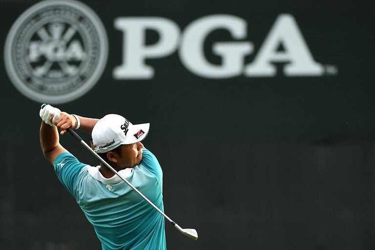 Hideki Matsuyama In Front Of Pga Logo Wallpaper