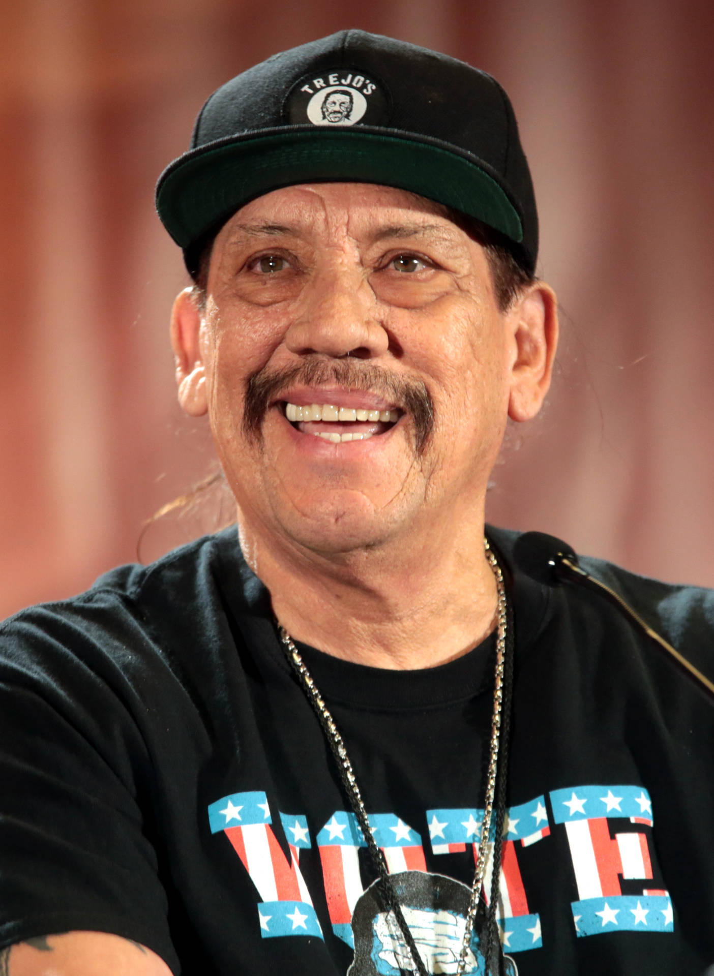 Hollywood Icon Danny Trejo Sporting A Vote Shirt Wallpaper