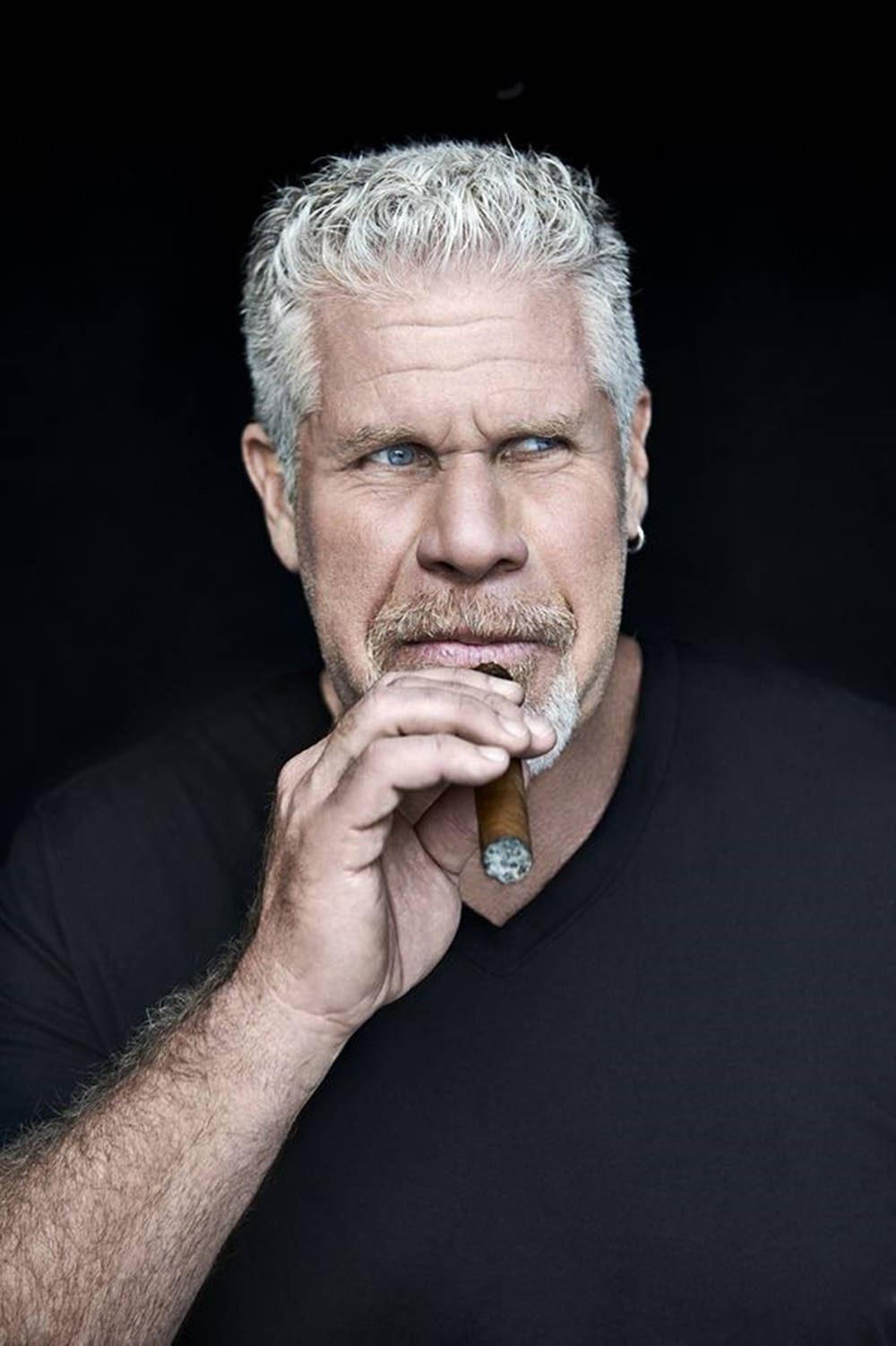 Hollywood Icon Ron Perlman Puffs On A Giant Cigar Wallpaper