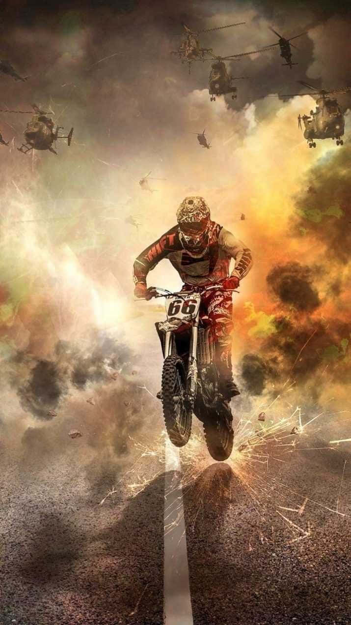 Honda Dirt Bike Biker Explosion Behind Wallpaper