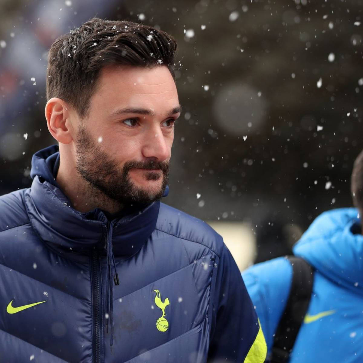 Hugo Lloris - The Goalkeeper Star Standing Confidently On A Snowy Day Wallpaper