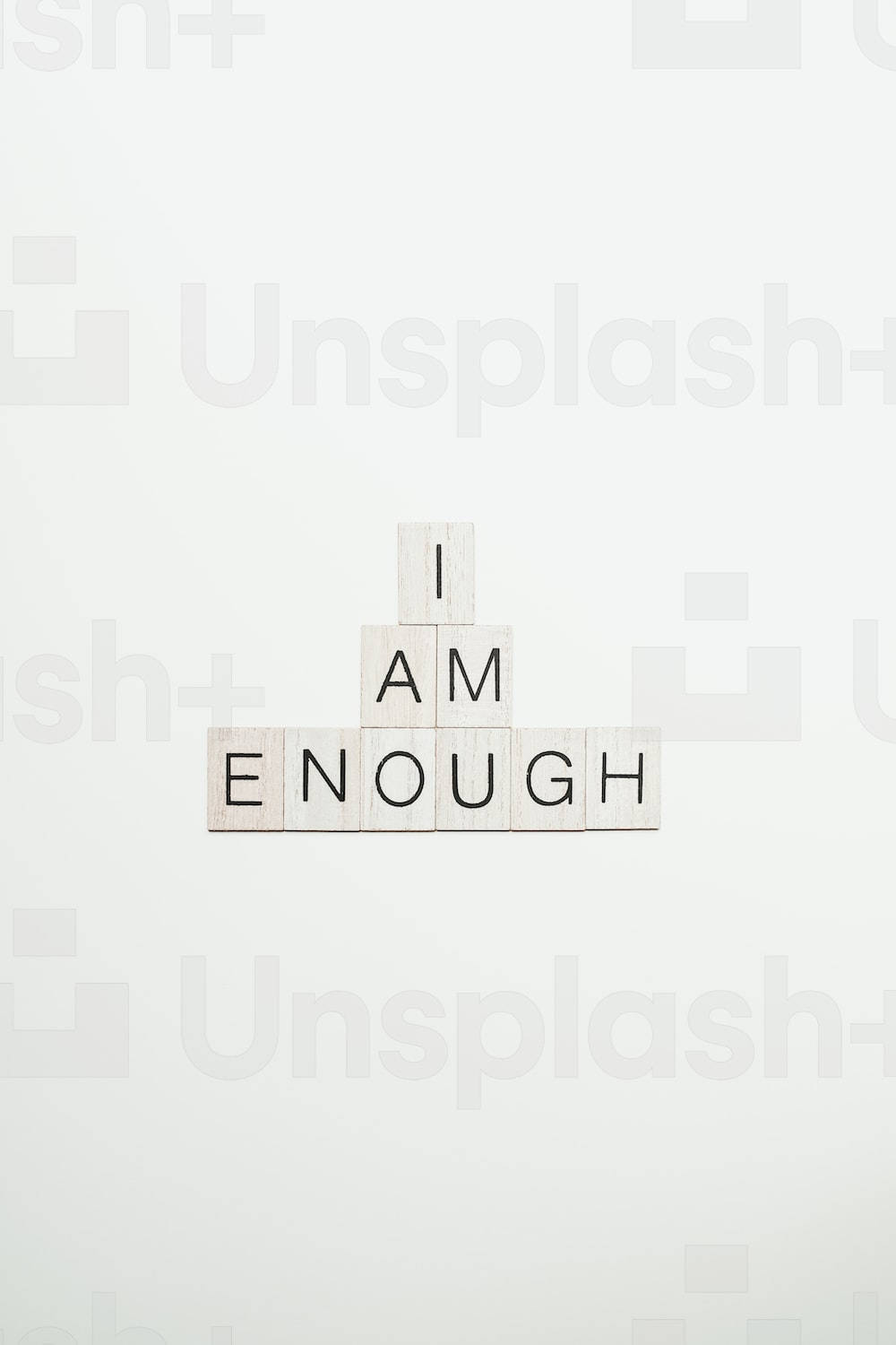 I Am Enough - A Wooden Block With The Word I Am Enough Wallpaper