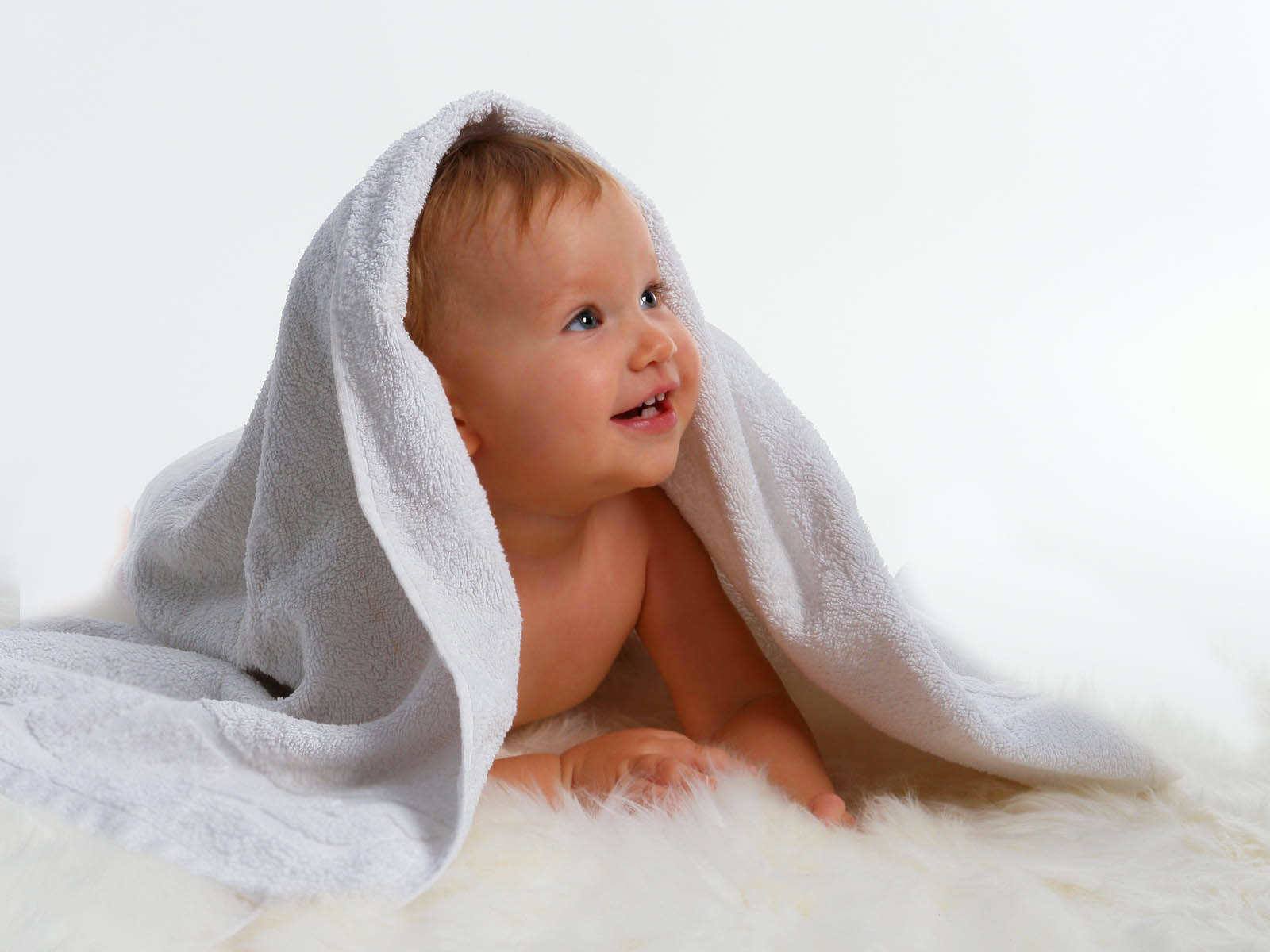 Innocent Charm - Baby Under White Fabric Wallpaper