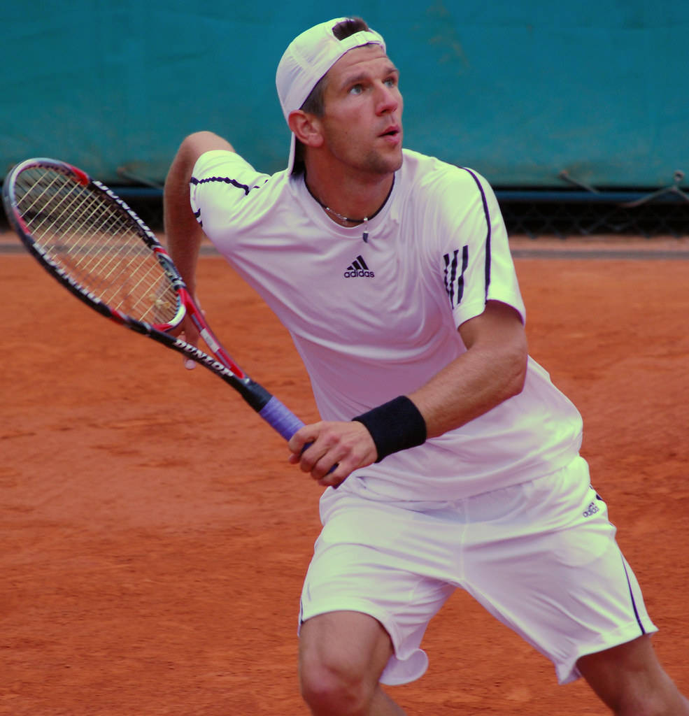 Intense Action: Jurgen Melzer In Pursuit Of The Tennis Ball Wallpaper