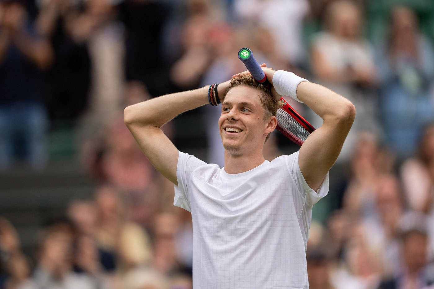 Intense Denis Shapovalov During A Tennis Game. Wallpaper