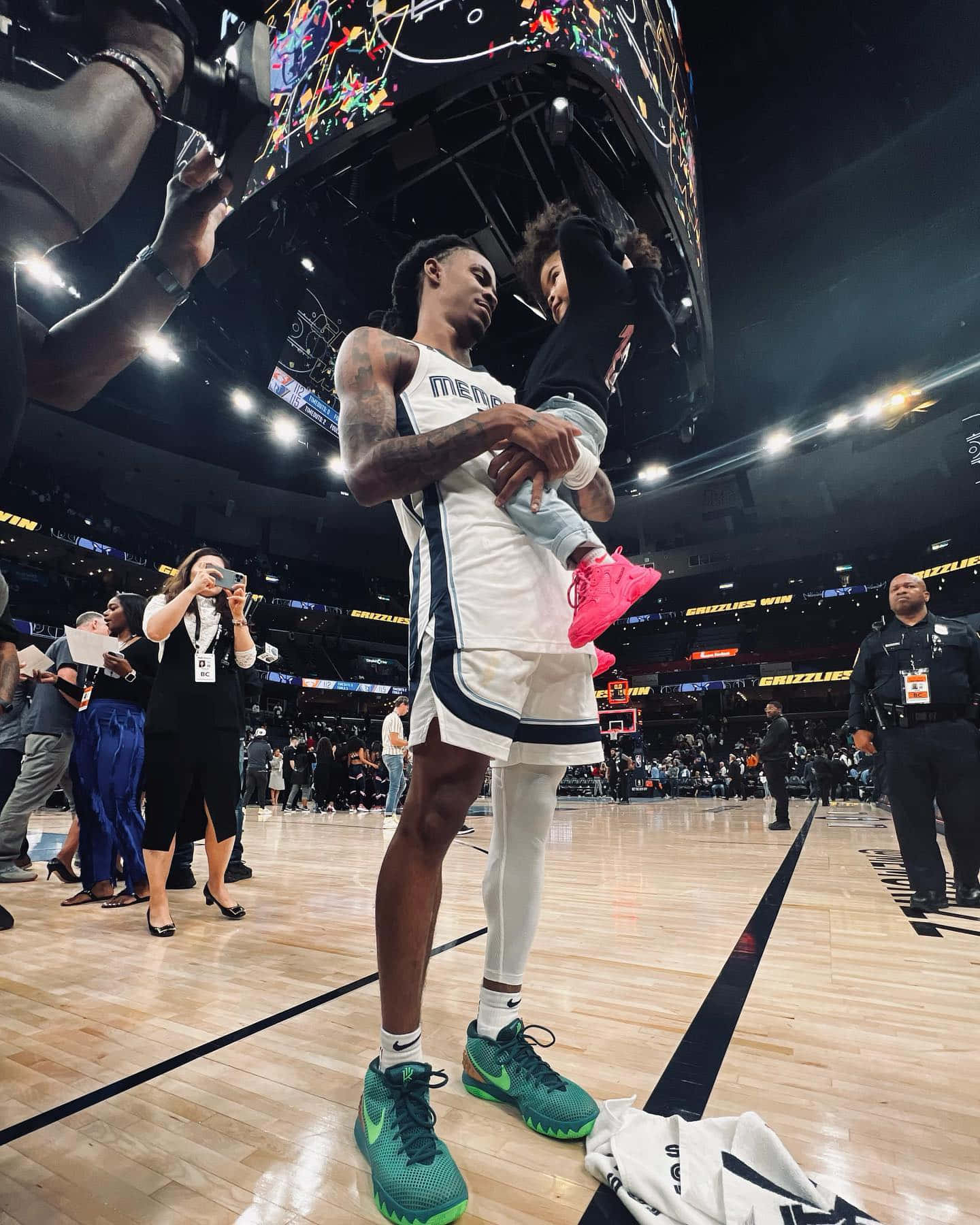 Ja Morrant Holding His Child Wallpaper