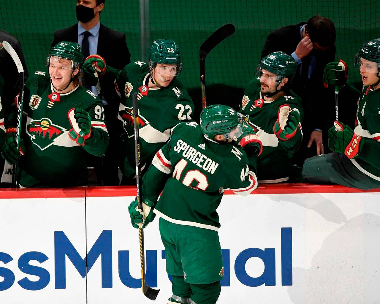 Jared Spurgeon Celebrating On The Hockey Bench After A Successful Play Against The Philadelphia Flyers. Wallpaper